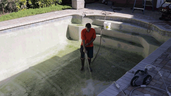 How To Drain and Clean A Swimming Pool - hose down debris