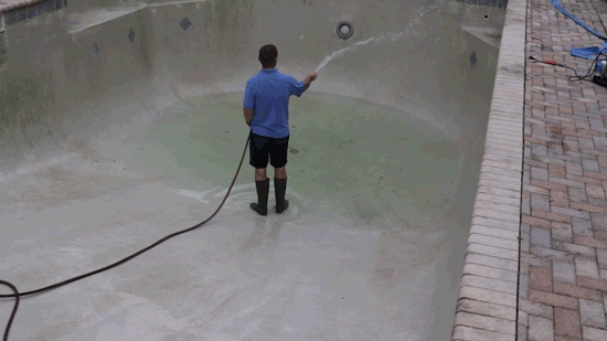 How To Drain and Clean A Swimming Pool - wet walls before applying chlorine